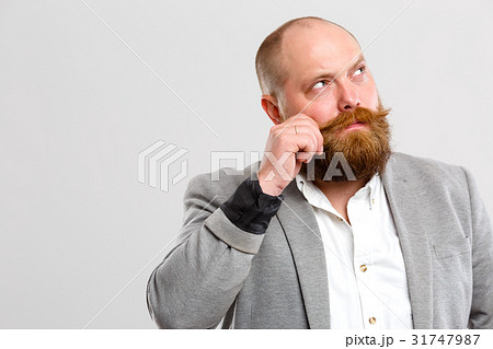 Man beard looking into side 31747987