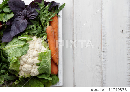 Fresh vegetables and herbs in wooden box Fresh vegetables and herbs in wooden box 31749378