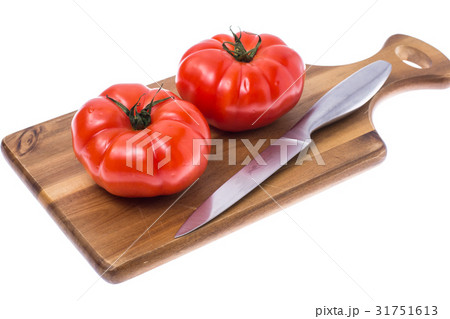 Red tomato on wooden board Red tomato on wooden board 31751613