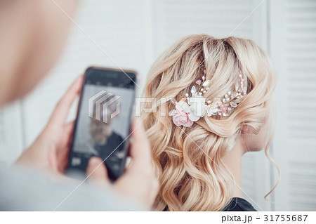 Hair stylist takes pictures of the prepared 31755687