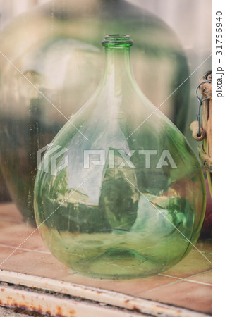 Old empty wine bottles behind the glass 31756940