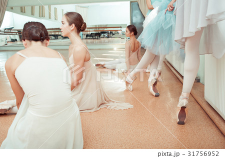 The seven ballerinas at ballet bar 31756952