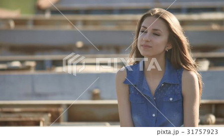 The girl is sitting on the bridge. Sexy beautiful The girl is sitting on the bridge. Sexy beautiful 31757923