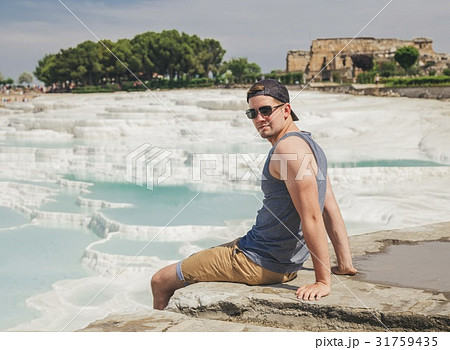 Man seat on the rock in a sea 31759435