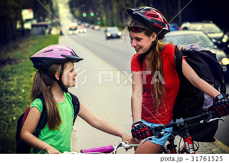 Bicyclist child ride on city bicycle path . Girls 31761525