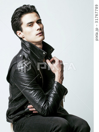 young handsome man, leather jacked on naked torso 31767789