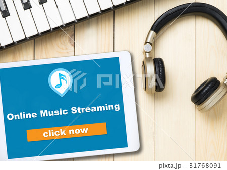 Online Music streaming button on tablet screen 31768091