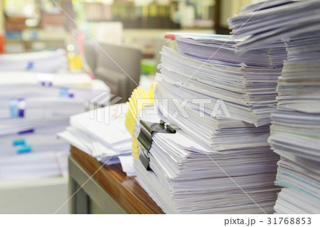 Pile of unfinished documents on office desk Pile of unfinished documents on office desk 31768853