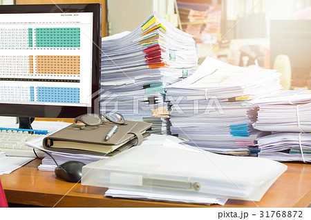 Pile of unfinished documents on office desk Pile of unfinished documents on office desk 31768872