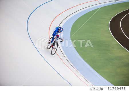 Racing cyclist on velodrome outdoor. Racing cyclist on velodrome outdoor. 31769473