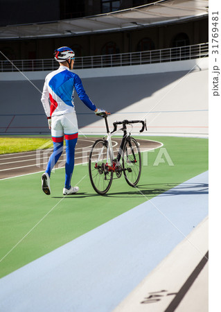 Racing cyclist on velodrome outdoor. 31769481