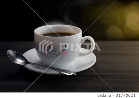 White mug of coffee with a happy smile 31770621
