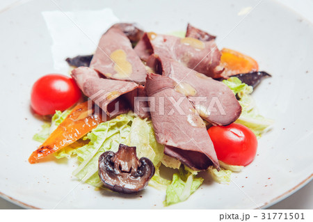 Salad with thin pieces of meat, mushrooms and 31771501