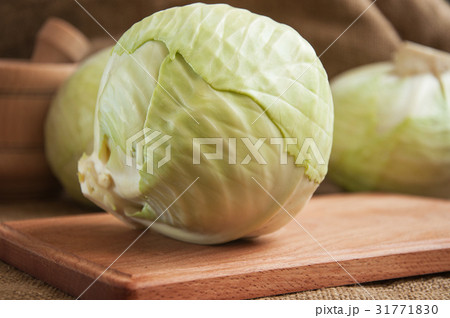 cabbage on a wooden board on a burlap cabbage on a wooden board on a burlap 31771830