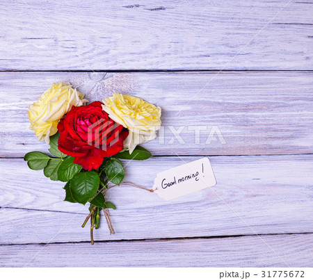 roses and a paper tag with an inscription  31775672