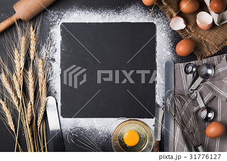 Baking ingredients on wood background 31776127