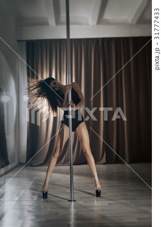 Girl pole dancer on training.  31777433