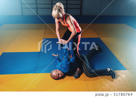Woman fights with man, self-defense technique 31780764