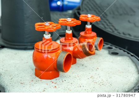 Red valves closeup, new pressure controllers Red valves closeup, new pressure controllers 31780947