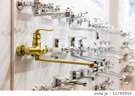 Water faucets on the shelf closeup, plumbing shop Water faucets on the shelf closeup, plumbing shop 31780949