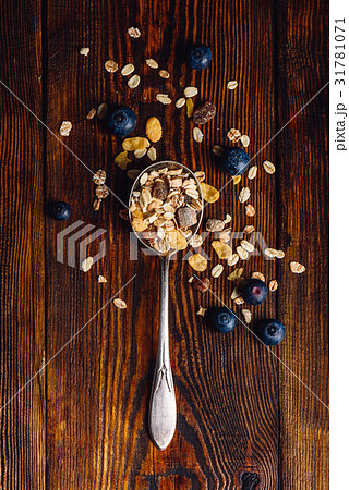 Spoonful of Granola and Blueberry. Spoonful of Granola and Blueberry. 31781071