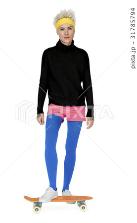 Trendy Woman Standing on a Skateboard Trendy Woman Standing on a Skateboard 31785794