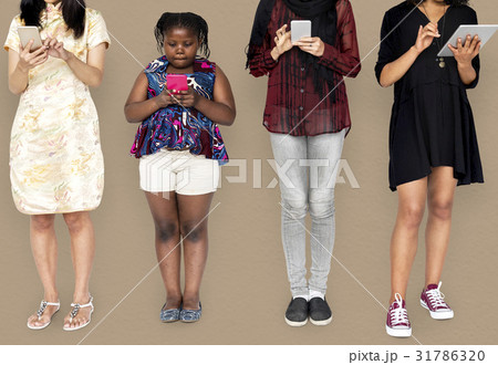 Group of Diverse Women Using Digital Devices Studio Portrait Group of Diverse Women Using Digital Devices Studio Portrait 31786320