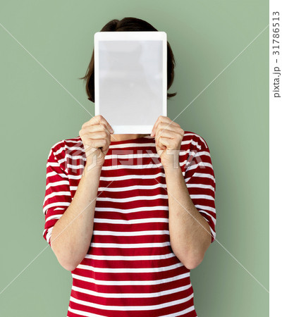 Adult Woman Face Covered with Blank Tablet Adult Woman Face Covered with Blank Tablet 31786513