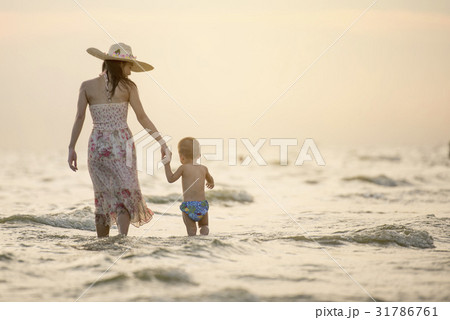 Family fun in sea beach surf Happy mother son Family fun in sea beach surf Happy mother son 31786761