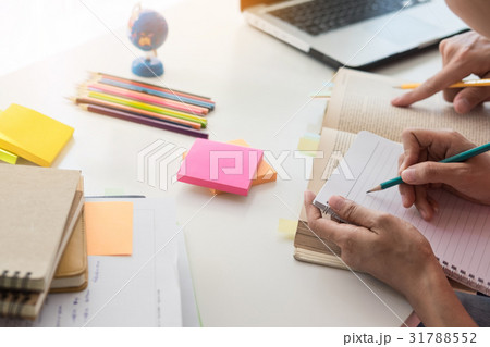 Young woman and man studying for a test/ an exam. Young woman and man studying for a test/ an exam. 31788552