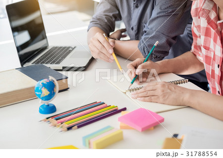 Young woman and man studying for a test/ an exam Young woman and man studying for a test/ an exam 31788554