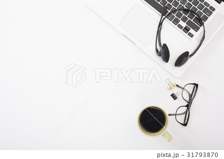 Modern Office desk with computer, headset, coffee. Modern Office desk with computer, headset, coffee. 31793870