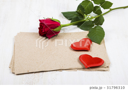 Red rose, hearts and paper for congratulations 31796310