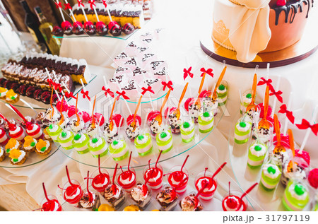 Delicious sweets on wedding candy buffet with 31797119