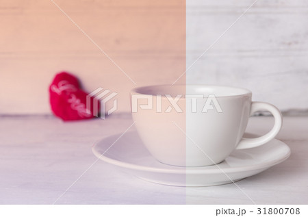 Coffee cup and red heart on wooden background 31800708