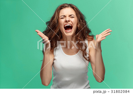 Portrait of young woman with shocked facial 31802084