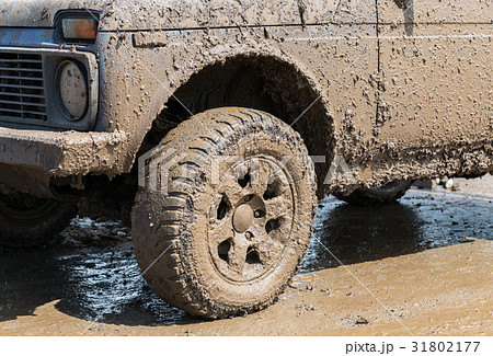 Dirty wheel of an off-road car after driving   31802177
