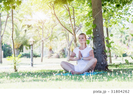Young cute woman stretching in park 31804262