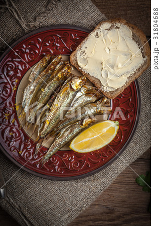 Tasty smoked sprats. 31804688