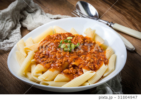Pasta penne with tomato bolognese sauce. Pasta penne with tomato bolognese sauce. 31804947