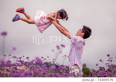 father and daughter having fun to play together father and daughter having fun to play together 31809576