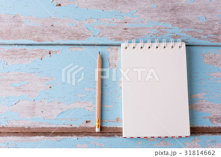 Top view work space notebook and brown pencil on  31814662