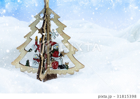 wood snowman on the Christmas tree with light and wood snowman on the Christmas tree with light and 31815398