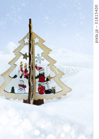wood snowman on the Christmas tree with light and wood snowman on the Christmas tree with light and 31815400