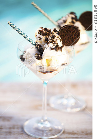Vanilla sundae ice cream with chocolate sauce and Vanilla sundae ice cream with chocolate sauce and 31815990