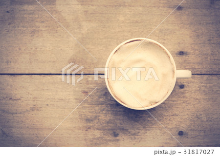 Cup of coffee on grunge wood in vintage style Cup of coffee on grunge wood in vintage style 31817027