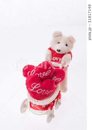 Cute teddy bear carry love heart item on bicycle.. Cute teddy bear carry love heart item on bicycle.. 31817149