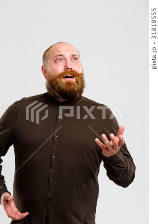 Man in shirt looks up 31818555