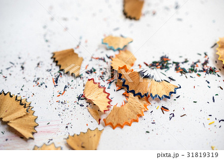 Color pencil shaves on a white paper Color pencil shaves on a white paper 31819319
