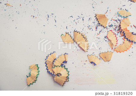 Color pencil shaves on a white paper, warm tone Color pencil shaves on a white paper, warm tone 31819320